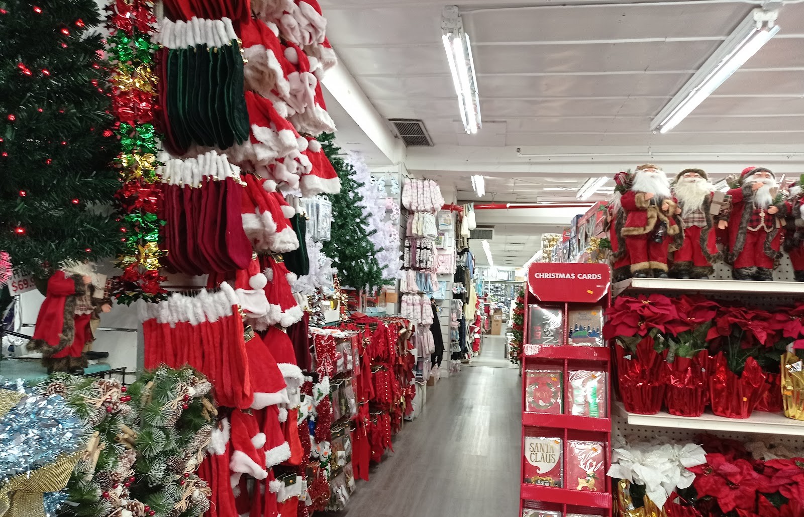 Christmas decorations, Santa hats and poinsettias at Peoples Department Store