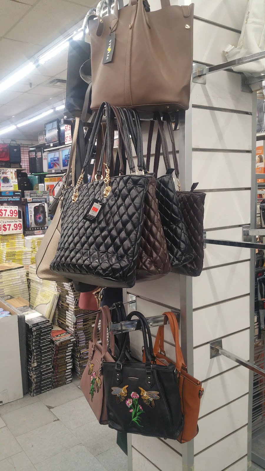 Handbags displayed on the accessories wall at Peoples Department Store
